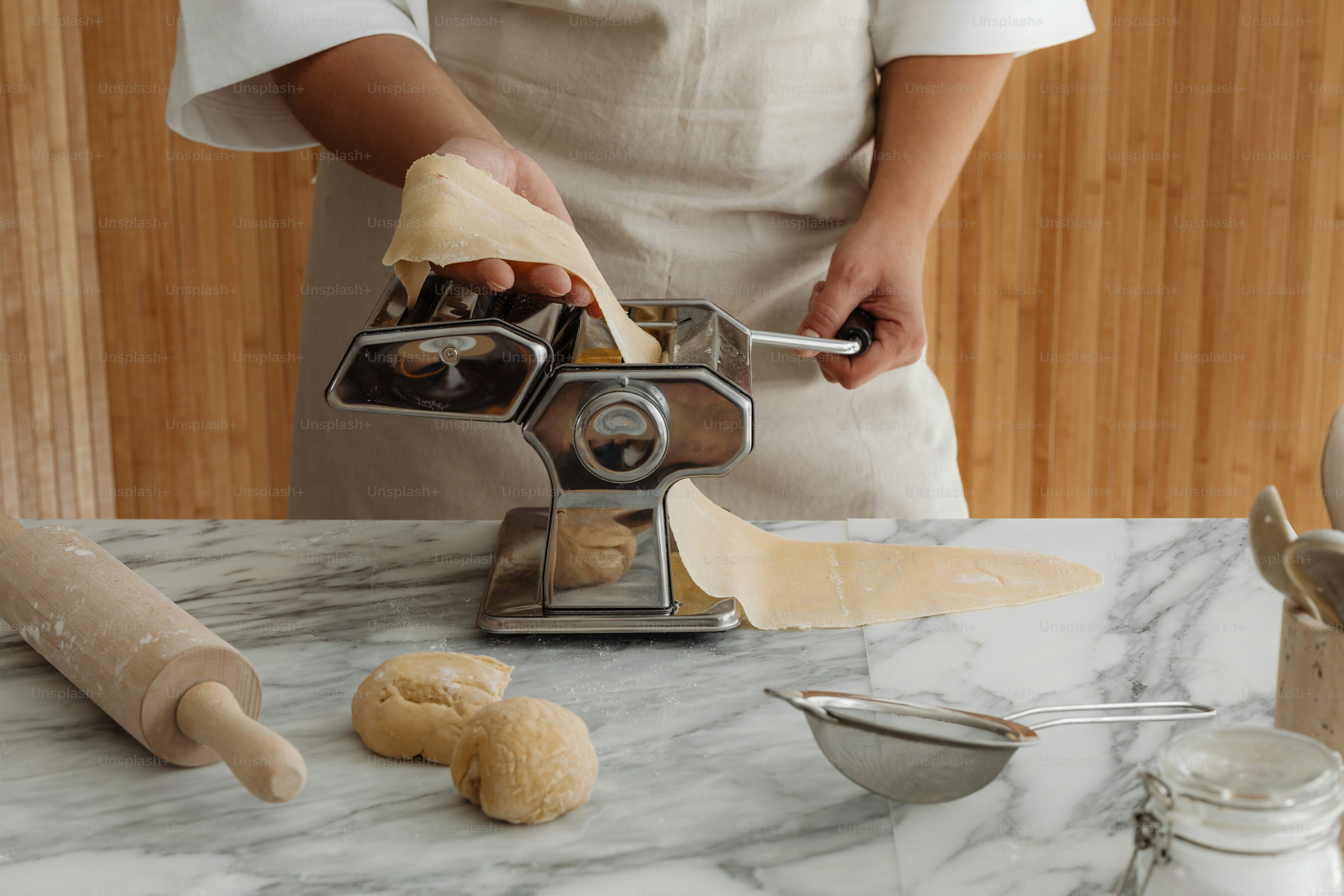 A person in a kitchen preparing food on a counter
